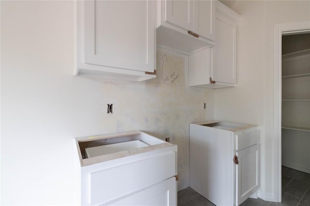 1921 Taines Turn, Norman, OK 73072 - laundry area with dark tile patterned floors