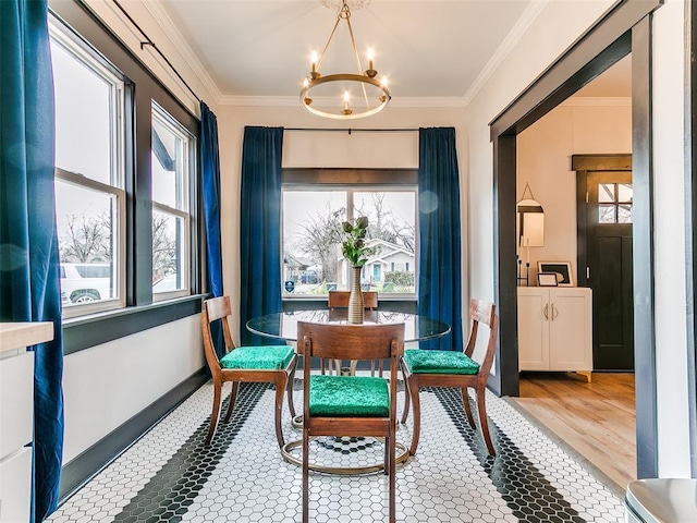 dining room with a notable chandelier, crown molding, and a wealth of natural light