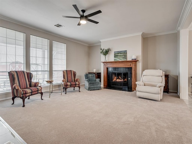 living area featuring light carpet, a fireplace, and ornamental molding