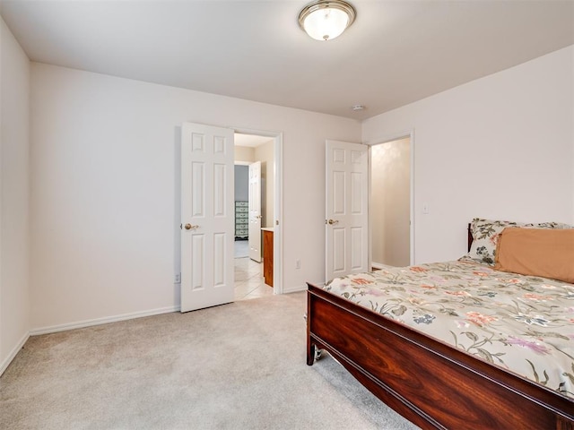 bedroom with light carpet