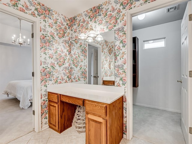 bathroom featuring vanity and a chandelier