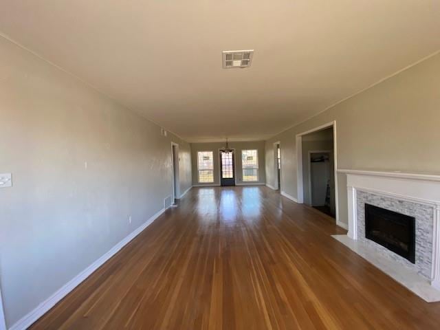 unfurnished living room with dark hardwood / wood-style flooring