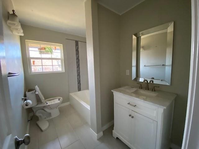 bathroom featuring tile patterned floors, vanity, and toilet