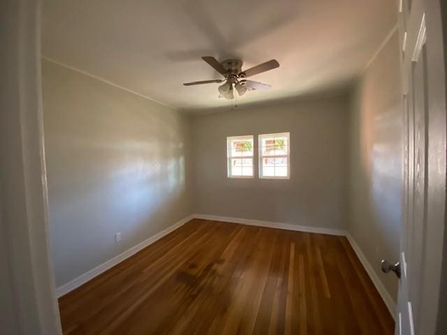 unfurnished room featuring dark hardwood / wood-style floors and ceiling fan