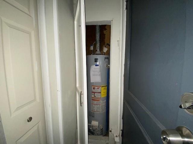 utility room featuring gas water heater