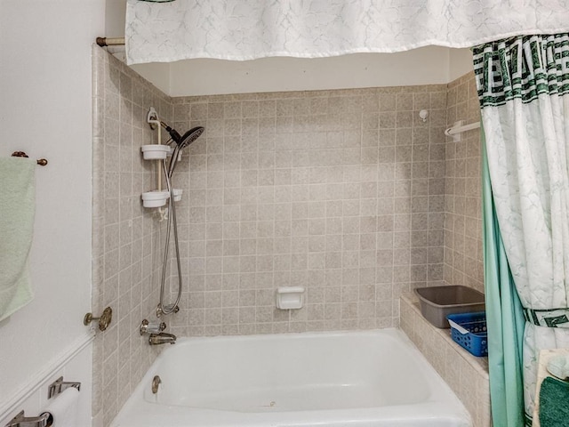 bathroom with shower / tub combo with curtain