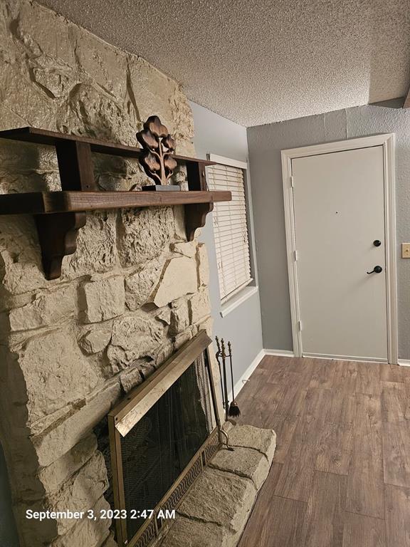 entrance foyer featuring hardwood / wood-style floors and a textured ceiling