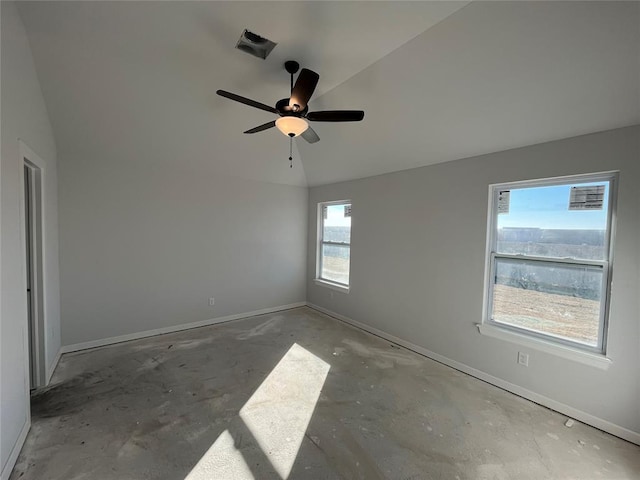 spare room with ceiling fan and concrete floors