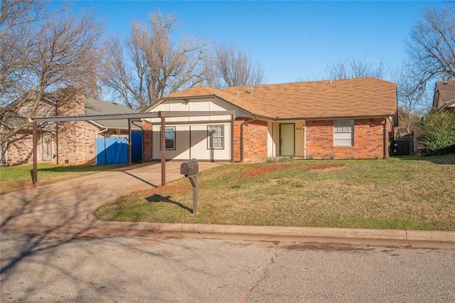 view of front of home with a front lawn, a carport, and central AC unit