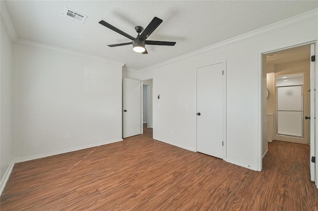 unfurnished bedroom with wood-type flooring, a textured ceiling, ceiling fan, and crown molding