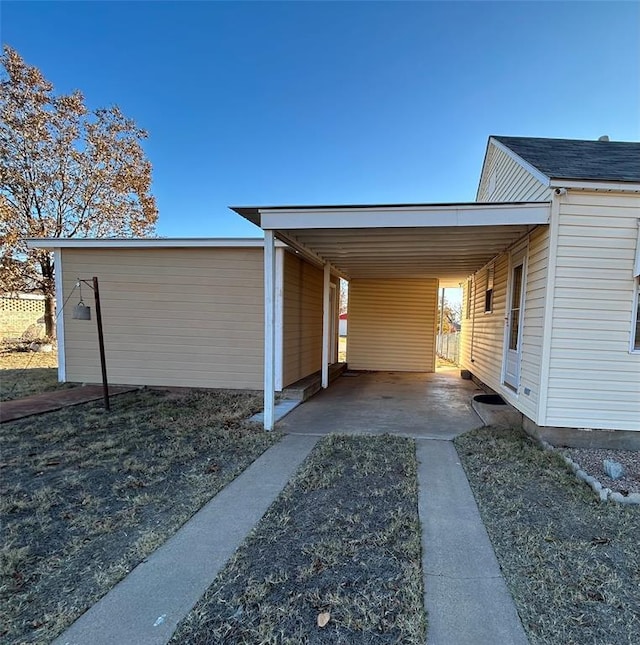 view of property exterior with a carport