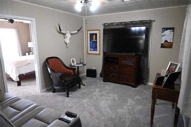 interior space with light carpet, ceiling fan, and ornamental molding