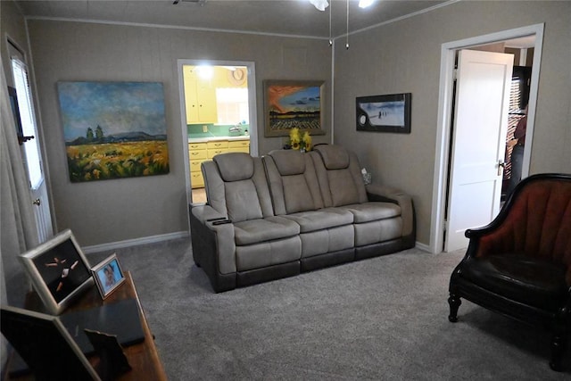 carpeted living room with crown molding