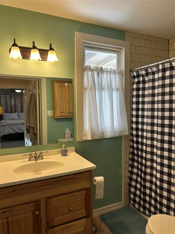 bathroom with vanity and toilet