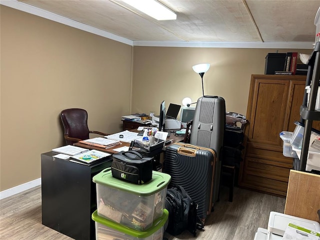 office with hardwood / wood-style floors and ornamental molding