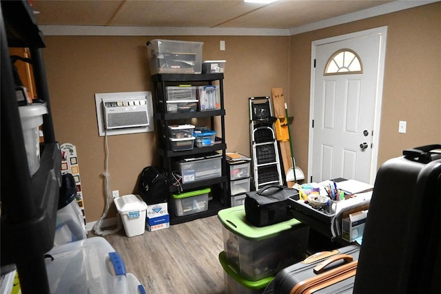 office area featuring wood-type flooring and a wall mounted AC