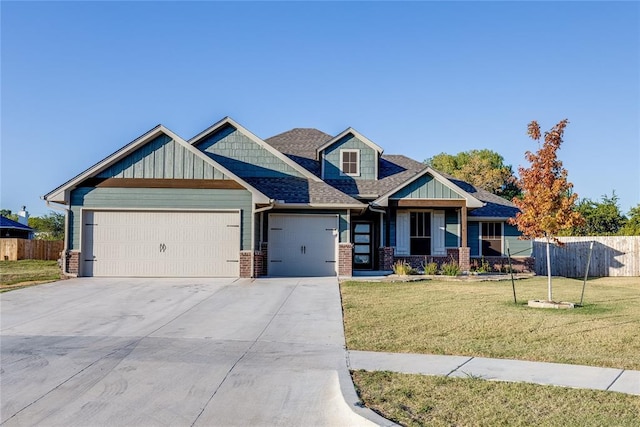 craftsman house featuring a front lawn and a garage