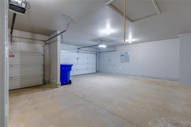 garage with electric panel and a garage door opener