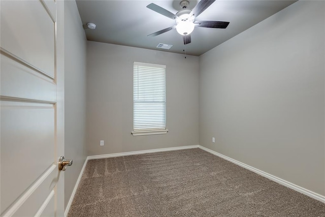 empty room featuring carpet flooring and ceiling fan