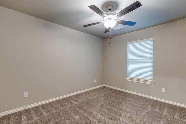 spare room with ceiling fan and carpet floors