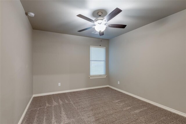 spare room with ceiling fan and carpet floors