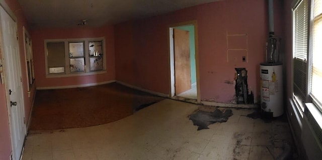 interior space with gas water heater and tile patterned floors