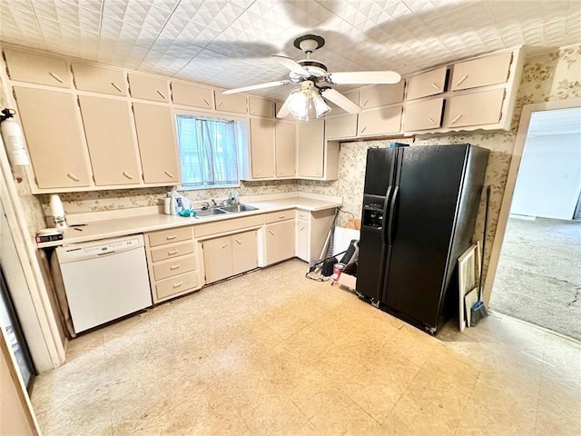 kitchen featuring dishwasher, light carpet, black fridge, sink, and ceiling fan