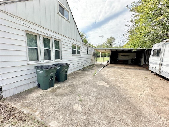 view of home's exterior with a carport