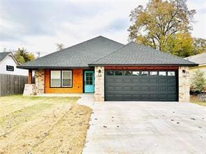 view of front of property featuring a garage