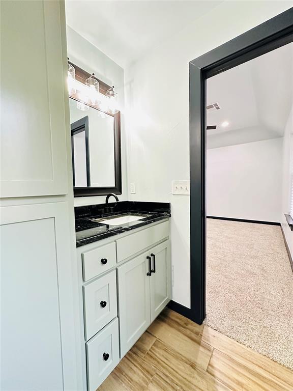 9 SW 24th St, Oklahoma City, OK 73109 - bathroom with vanity and wood finished floors