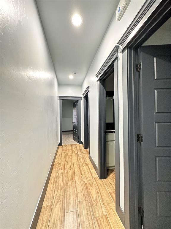 9 SW 24th St, Oklahoma City, OK 73109 - corridor featuring light wood-style floors and recessed lighting