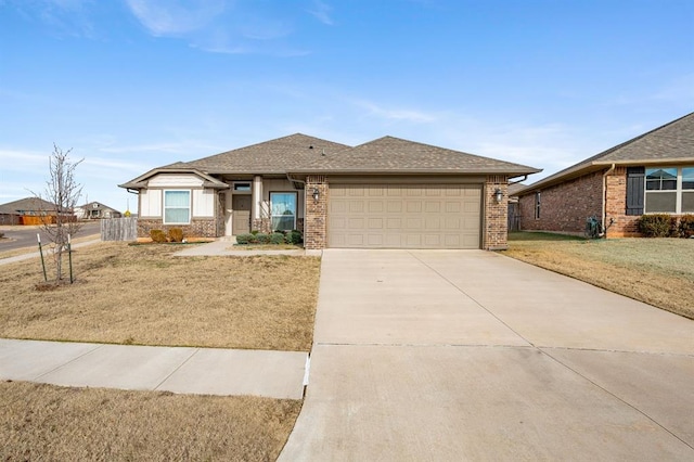 view of front of home with a garage and a front yard