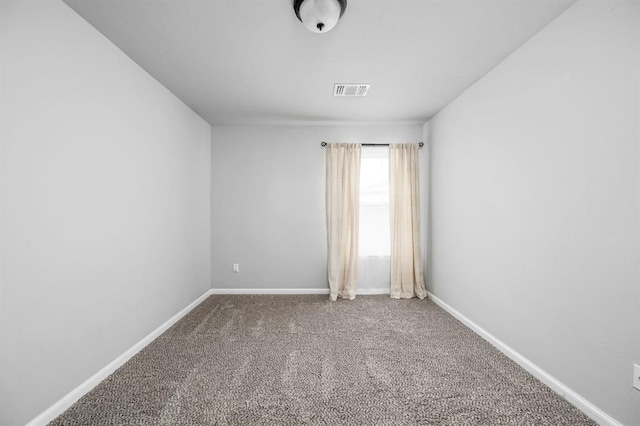 empty room featuring carpet flooring