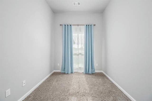 unfurnished room with carpet floors