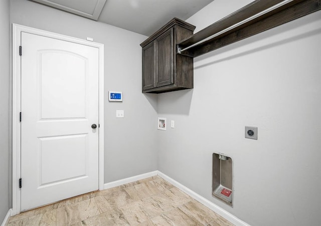 laundry room featuring cabinets, hookup for a washing machine, and electric dryer hookup