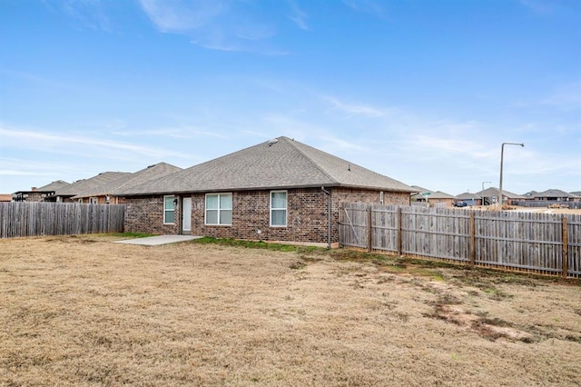 back of property featuring a patio