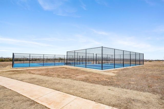 view of pool featuring tennis court