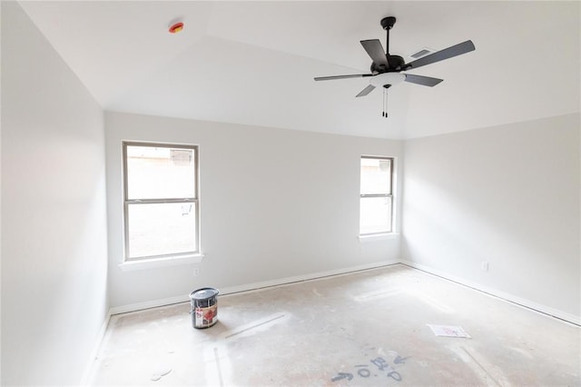 unfurnished room featuring vaulted ceiling, visible vents, a ceiling fan, and baseboards