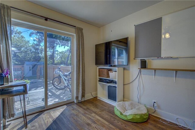 doorway to outside with plenty of natural light and hardwood / wood-style floors