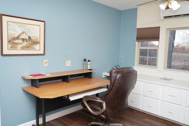 home office with ceiling fan, dark wood-type flooring, and a wall unit AC