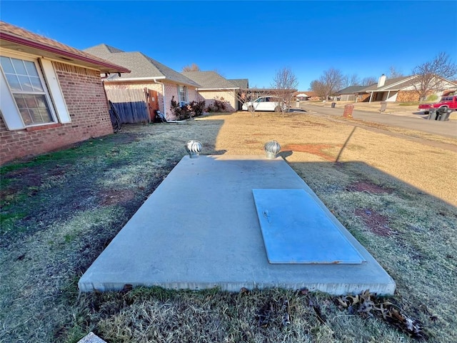 entry to storm shelter with a lawn