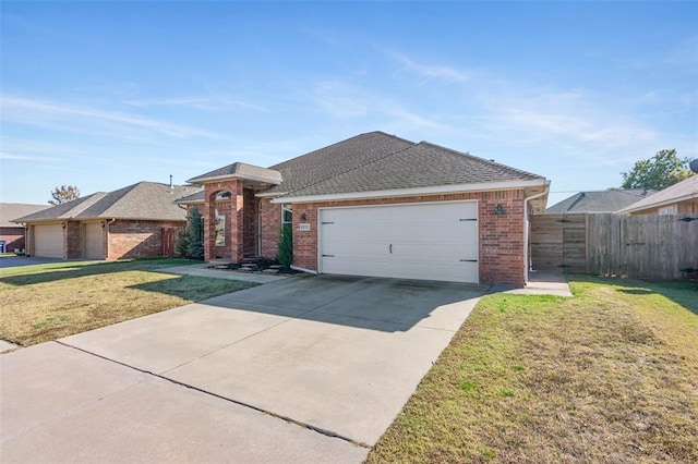 view of front of house with a garage and a front lawn