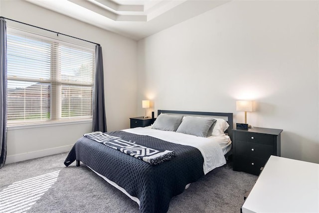 carpeted bedroom featuring multiple windows