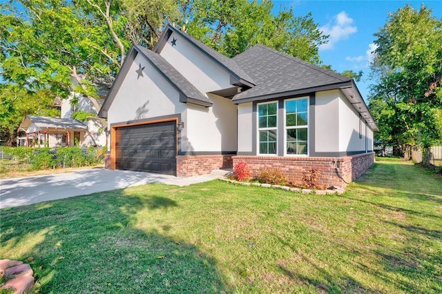 view of front of house with a front yard and a garage