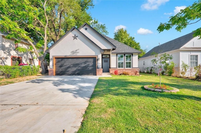 view of front of house featuring a garage and a front lawn