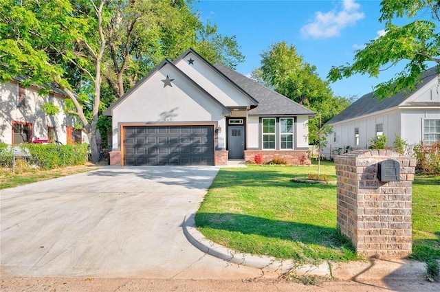 view of front facade with a front yard and a garage