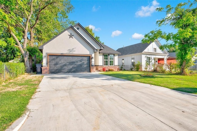 view of front facade with a front yard and a garage