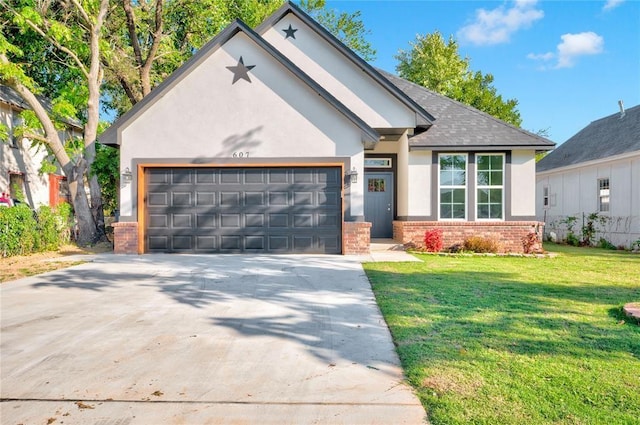 view of front of property featuring a garage and a front lawn