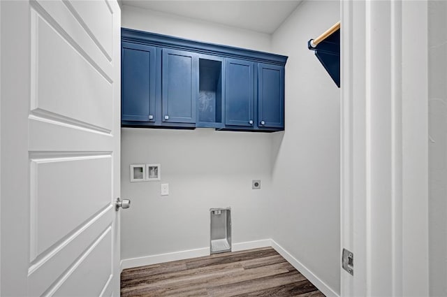 washroom with cabinets, hookup for a washing machine, hardwood / wood-style flooring, and electric dryer hookup