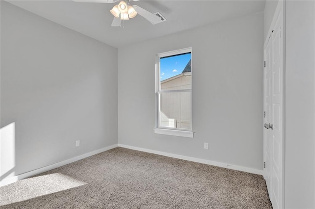 carpeted spare room with ceiling fan and a healthy amount of sunlight